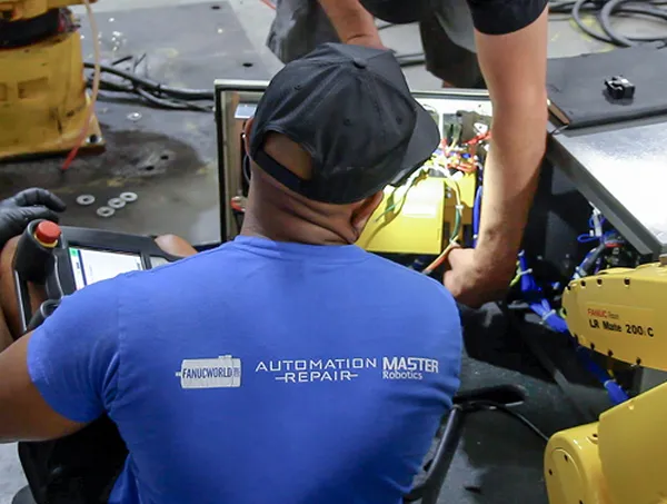 T.I.E. Industrial technicians servicing a Fanuc LR Mate robot